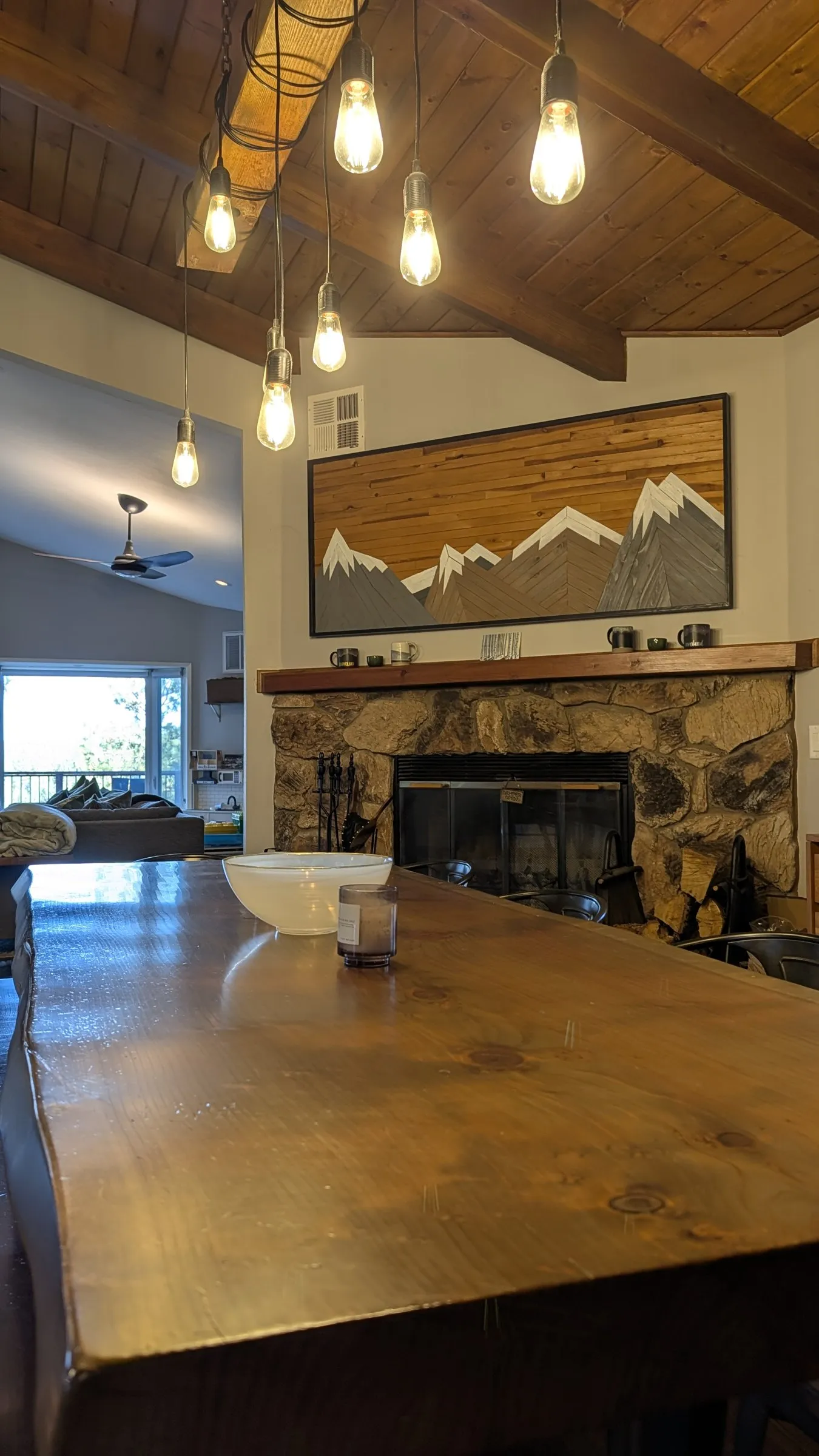 Dining table detail with mountain art above the fireplace