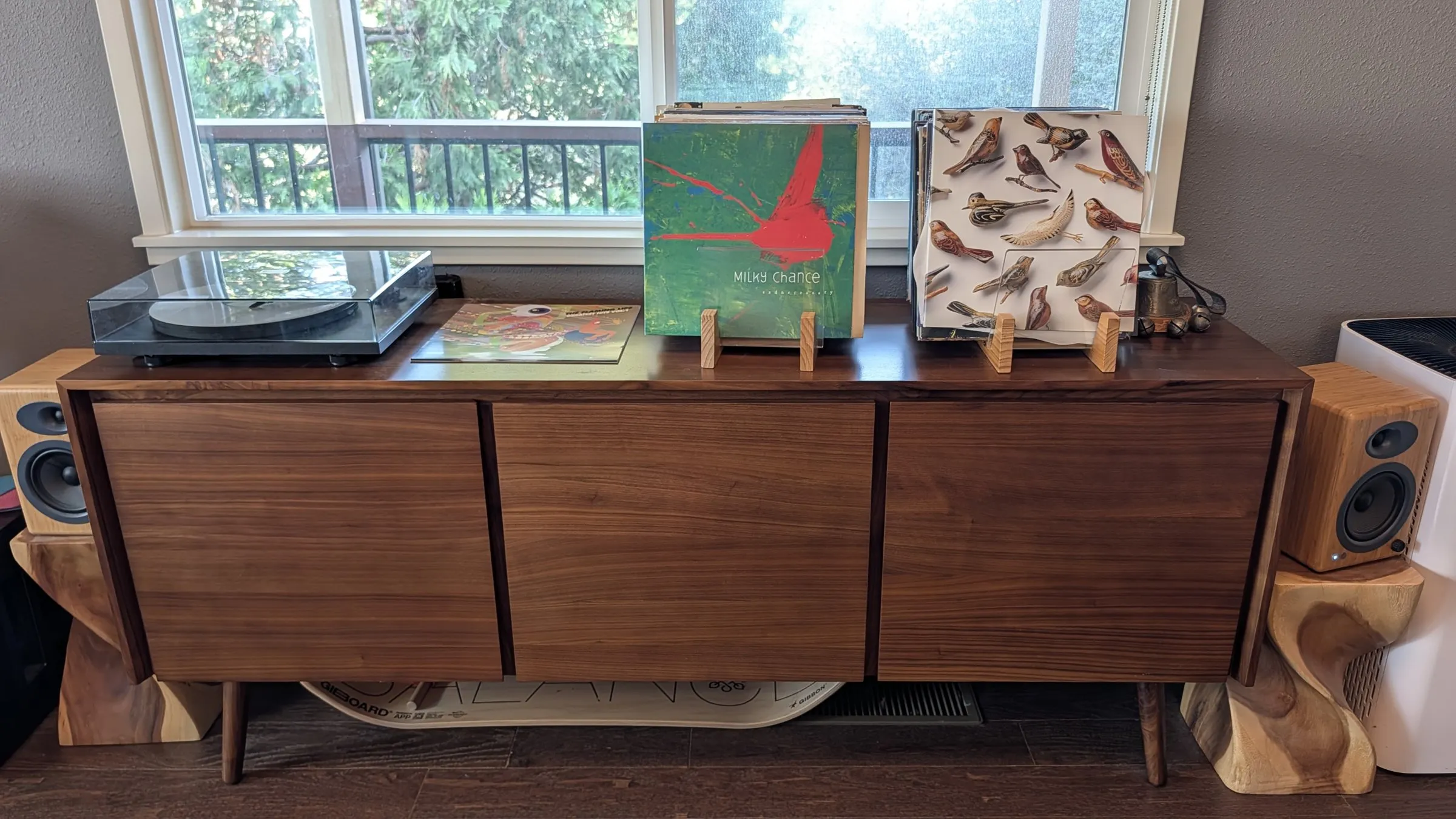 Walnut credenza with a record player and speakers