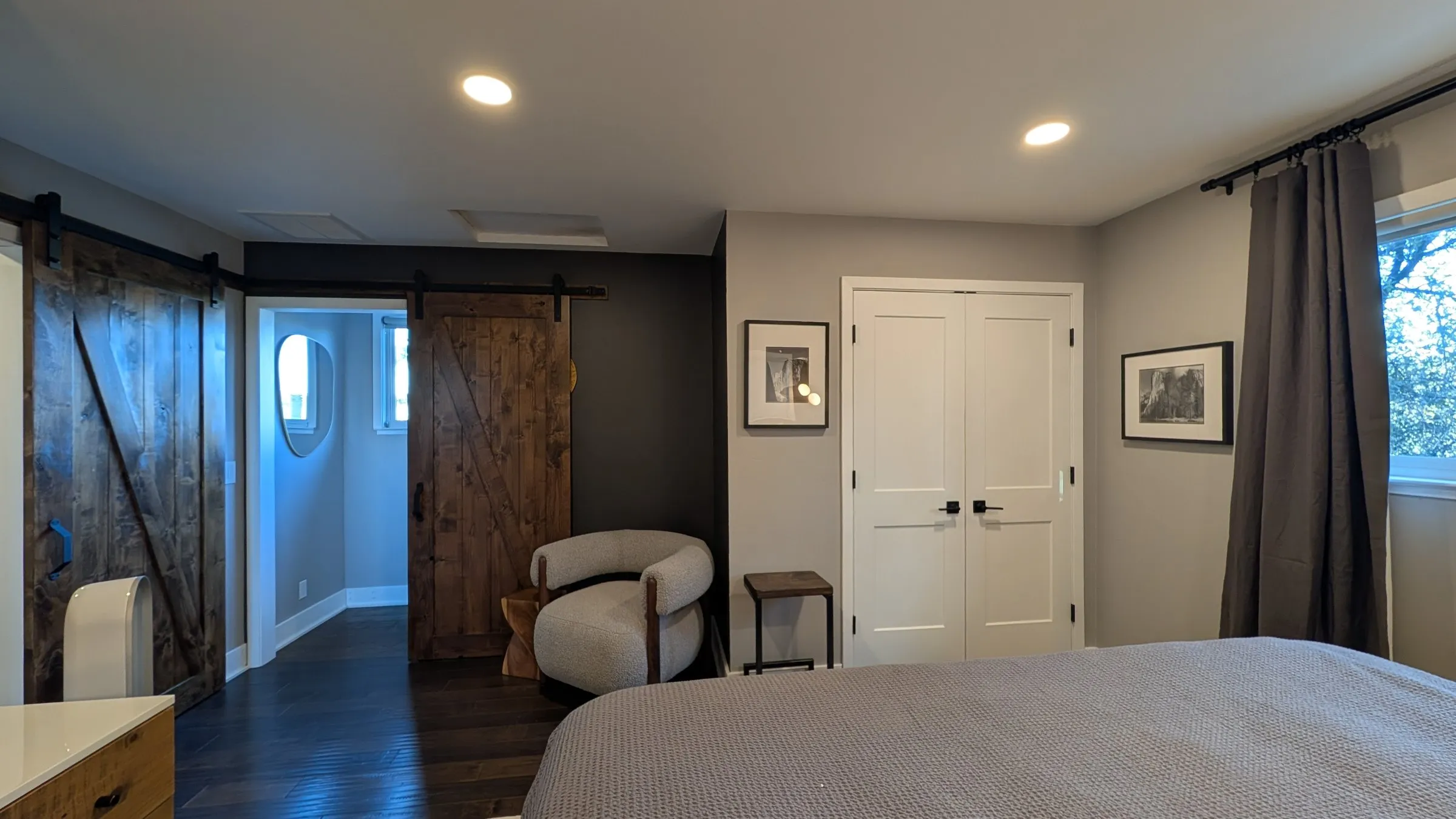 Primary suite seating corner and sliding barn doors
