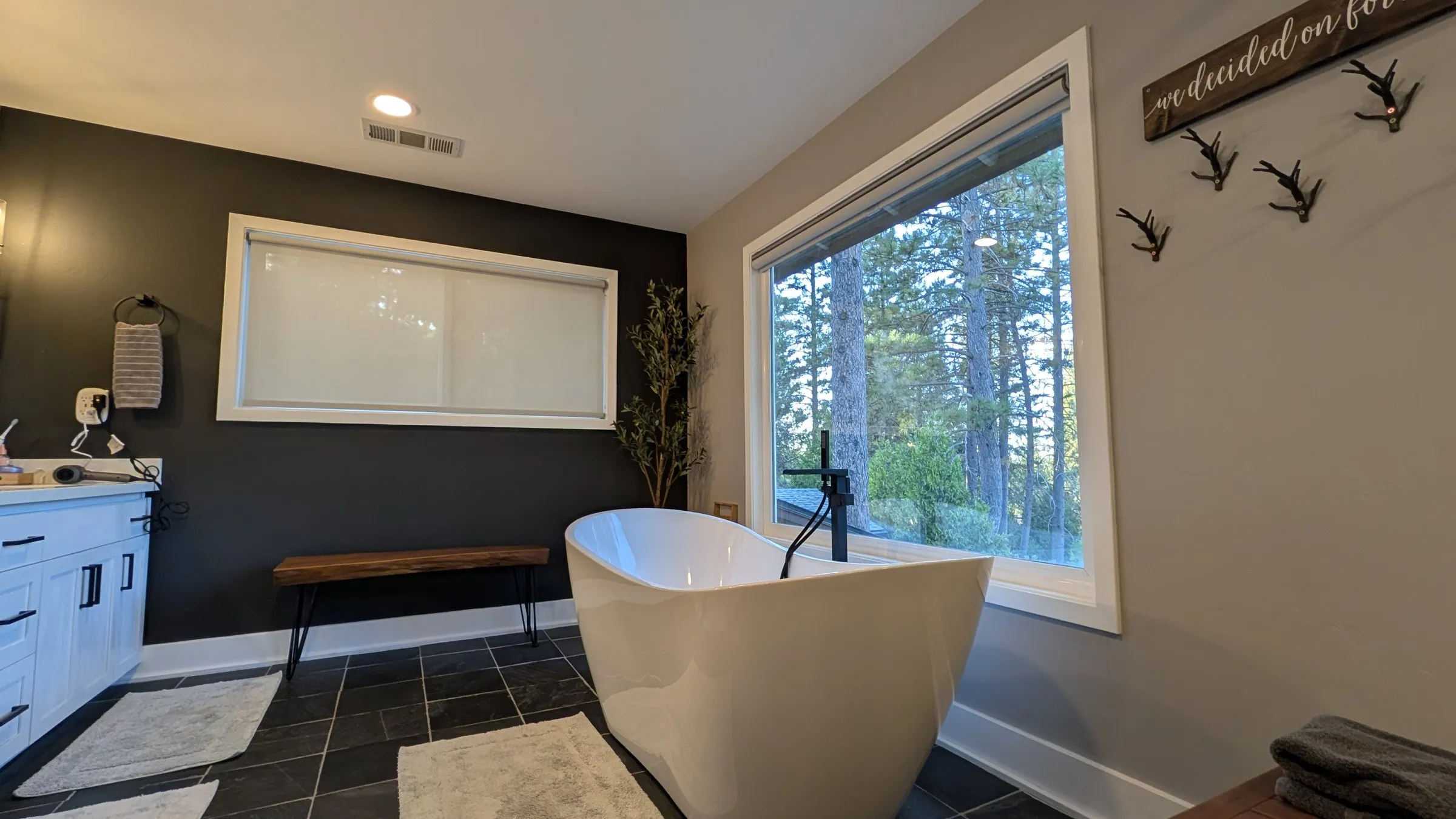 Soaking tub and bench in the primary bathroom